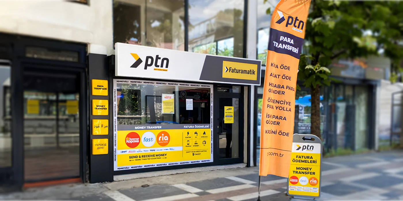 PTN konsept mağazası — Şanlıurfa Viranşehir: PTN tabelası, sarı hizmet kolonları, cam uygulamaları, yelken bayrak ve duba